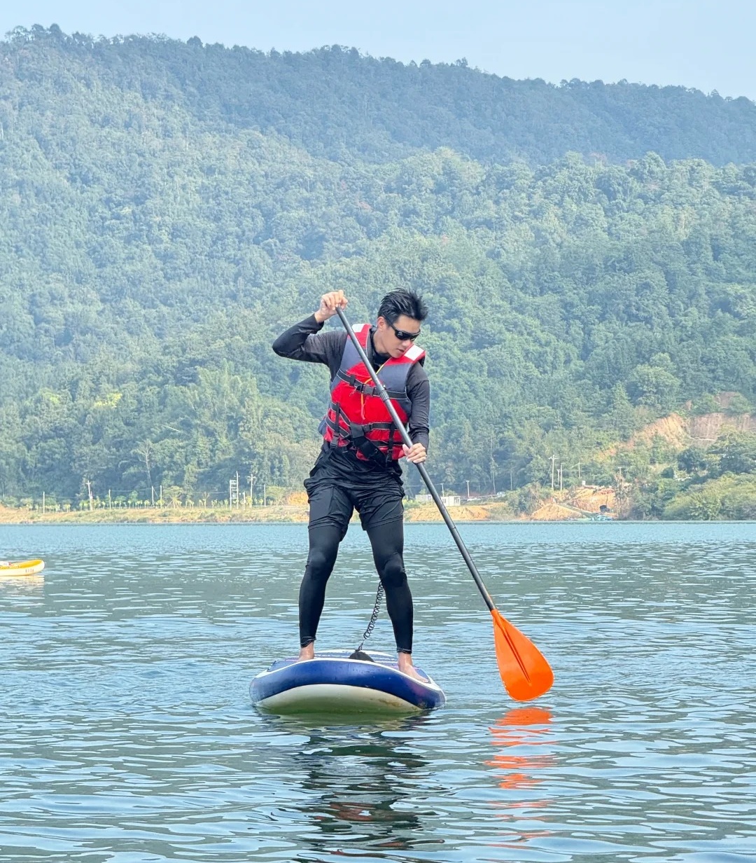 YD team member carrying water sports equipment
